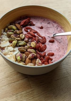 A picture of Fresh Strawberry and blueberry yoghurt breakfast smoothie bowl.