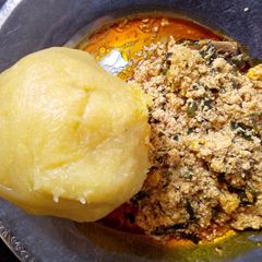 A picture of Melon soup and yellow Eba.