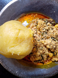 A picture of Melon soup and yellow Eba.