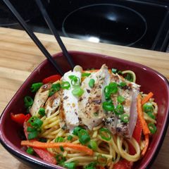 A picture of Grilled Cilantro Chicken with Spicy Thai noodles.