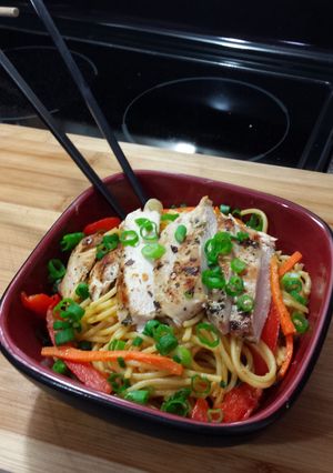A picture of Grilled Cilantro Chicken with Spicy Thai noodles.