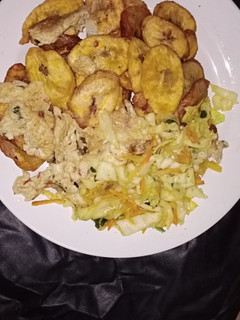 A picture of Fried plantain with cabbage egg sauce.