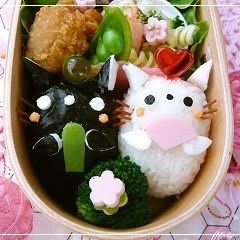 A picture of Bento with Twin Kitty Hina Dolls.