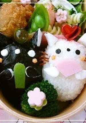 A picture of Bento with Twin Kitty Hina Dolls.