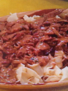 A picture of Braised beef and noodles.