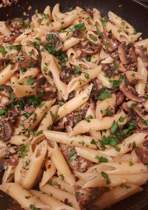 A picture of Penne with mushrooms.