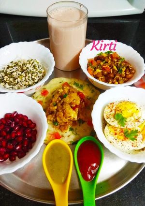 A picture of Semolina veggie uttapam with alu masala and combo.