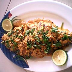 A picture of fish in coconut gravy.