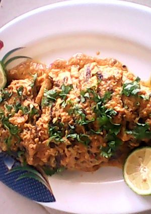 A picture of fish in coconut gravy.