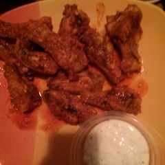 A picture of Buffalo garlic chicken wings.