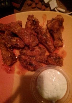 A picture of Buffalo garlic chicken wings.