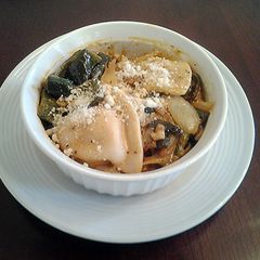 A picture of Pierogies with Sauteed Peppers and Onions.