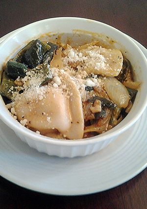 A picture of Pierogies with Sauteed Peppers and Onions.