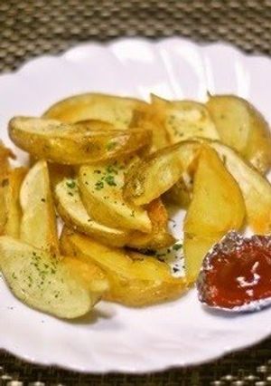 A picture of Thick Potato Wedges with Skins.