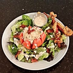 A picture of Chicken Salad Stuffed Tomato.