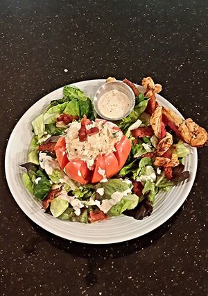 A picture of Chicken Salad Stuffed Tomato.