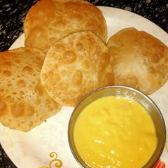 Sattu ki kachori with aamras A picture of Sattu ki kachori with aamras.
