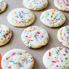 A picture of sugar cookies with sprinkles.