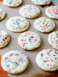 A picture of sugar cookies with sprinkles.