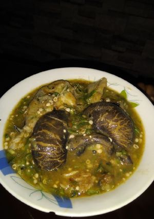 A picture of White Okro with fresh fish and snail.