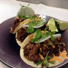 A picture of Asian beef tacos.