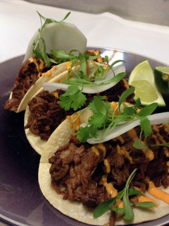 A picture of Asian beef tacos.