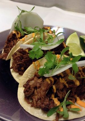 A picture of Asian beef tacos.