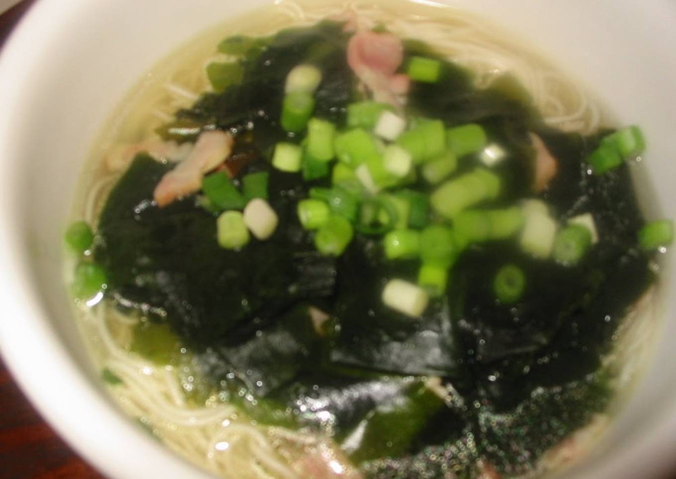 Light noodle soup with seeds and wakame seaweed