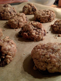 A picture of Oatmeal cookies with nuts & chocolate.