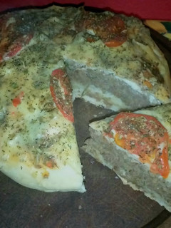Una foto de Hamburguesa a la pizza monumental