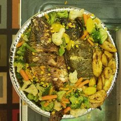 Grilled fish with fried plantain and vegetables A picture of Grilled fish with fried plantain and vegetables.
