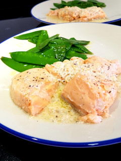 A picture of Sous vide salmon in a butter, ginger and lemon sauce.