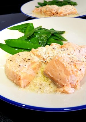 A picture of Sous vide salmon in a butter, ginger and lemon sauce.