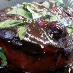 A picture of Pomegranate-Blueberry Glazed Pork Chop.