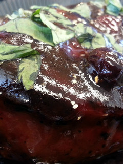 A picture of Pomegranate-Blueberry Glazed Pork Chop.