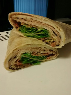 A picture of Chicken, Bacon, Avocado and Swiss wrap.