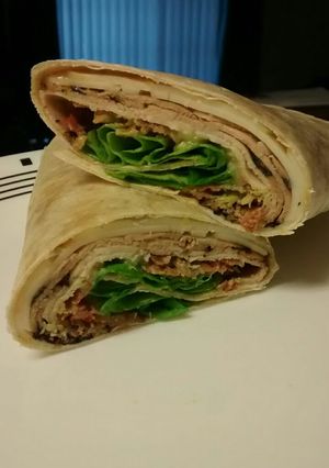 A picture of Chicken, Bacon, Avocado and Swiss wrap.