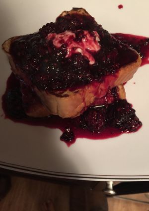 A picture of Vanilla French Toast With Sweet Cream Cheese And Fresh Blackberry Syrup.
