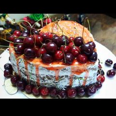 A picture of Eggless Naked cherry cake.