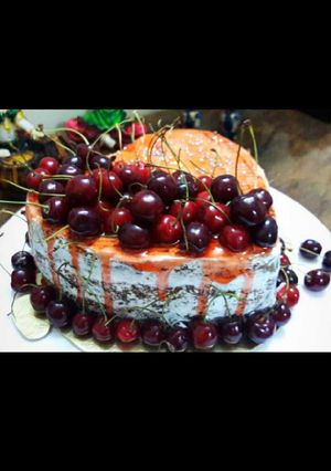 A picture of Eggless Naked cherry cake.