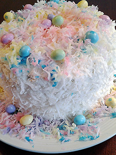 A picture of Coconut Cake with colored coconut decorations for any holiday.