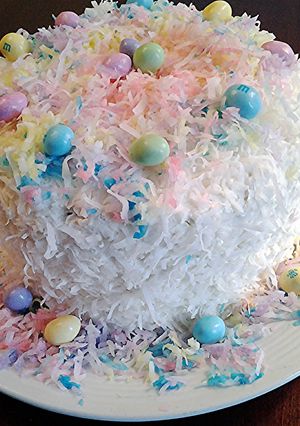 A picture of Coconut Cake with colored coconut decorations for any holiday.