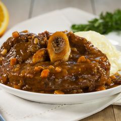 A picture of Osso Buco with Creamy Polenta and Citrus Gremolata.