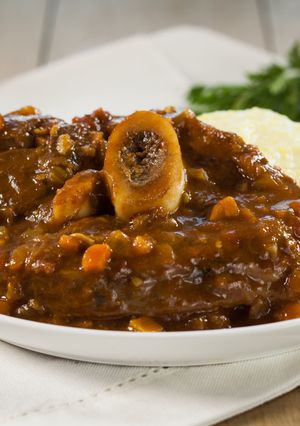 A picture of Osso Buco with Creamy Polenta and Citrus Gremolata.