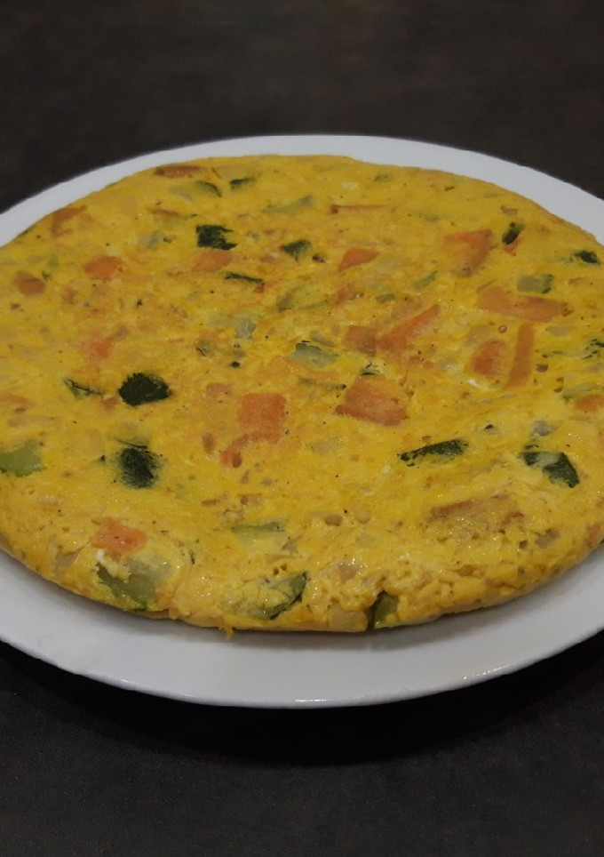 Una foto de Tortilla de calabacín y boniato especiado