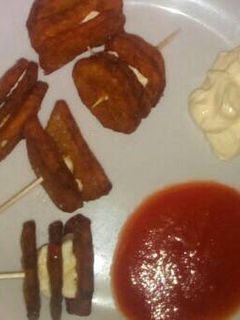 Una foto de Patatas con queso fundido