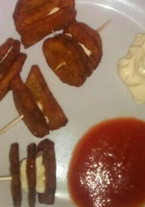 Una foto de Patatas con queso fundido