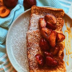 A picture of French Toast with grilled plums.