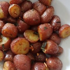 A picture of Crispy red potatoes with crispy garlic and sage butter.