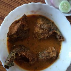 A picture of Fish curry with rice.